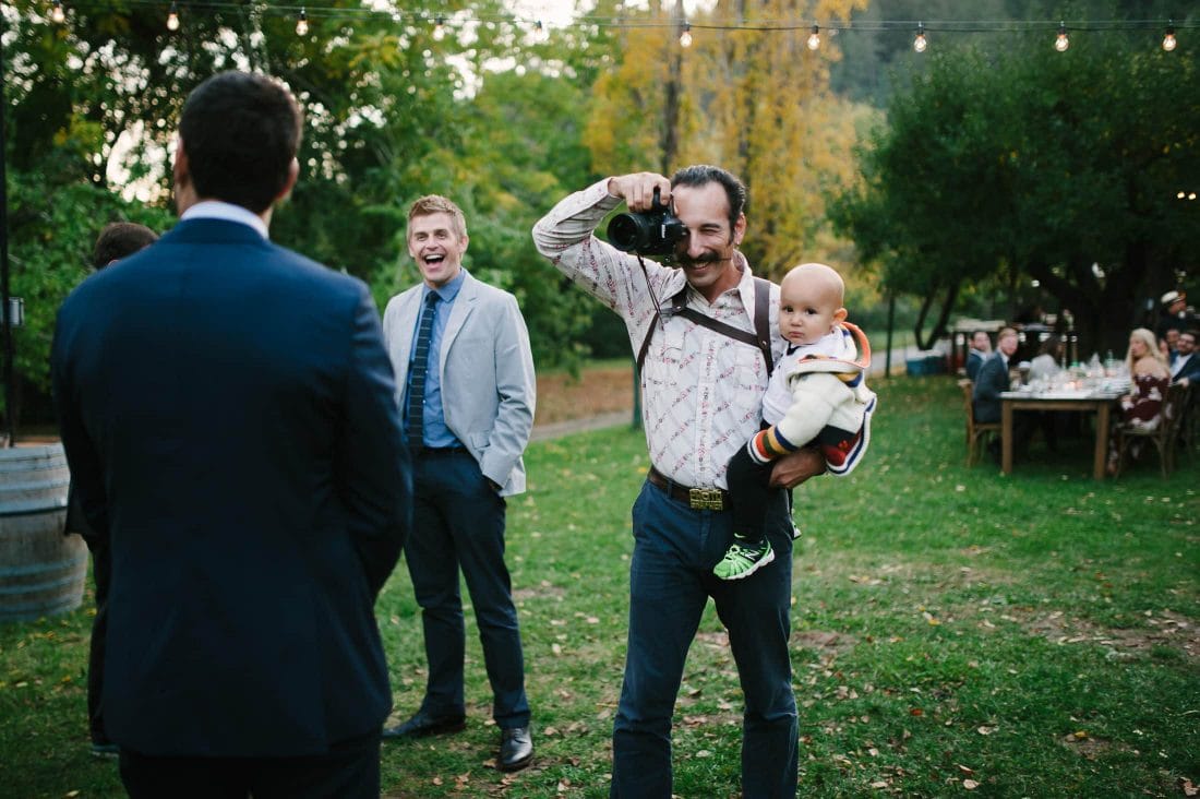 Dawn ranch wedding portrait of photographer and kid