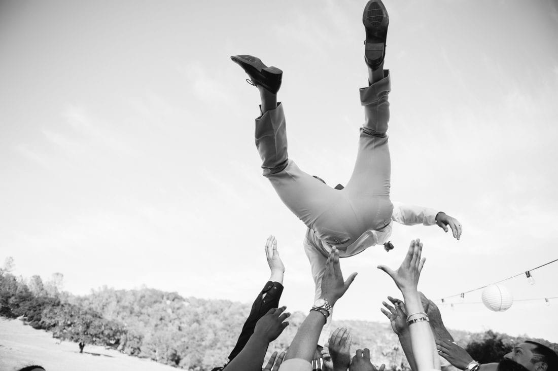 fun napa ranch wedding with groom tossed in the air