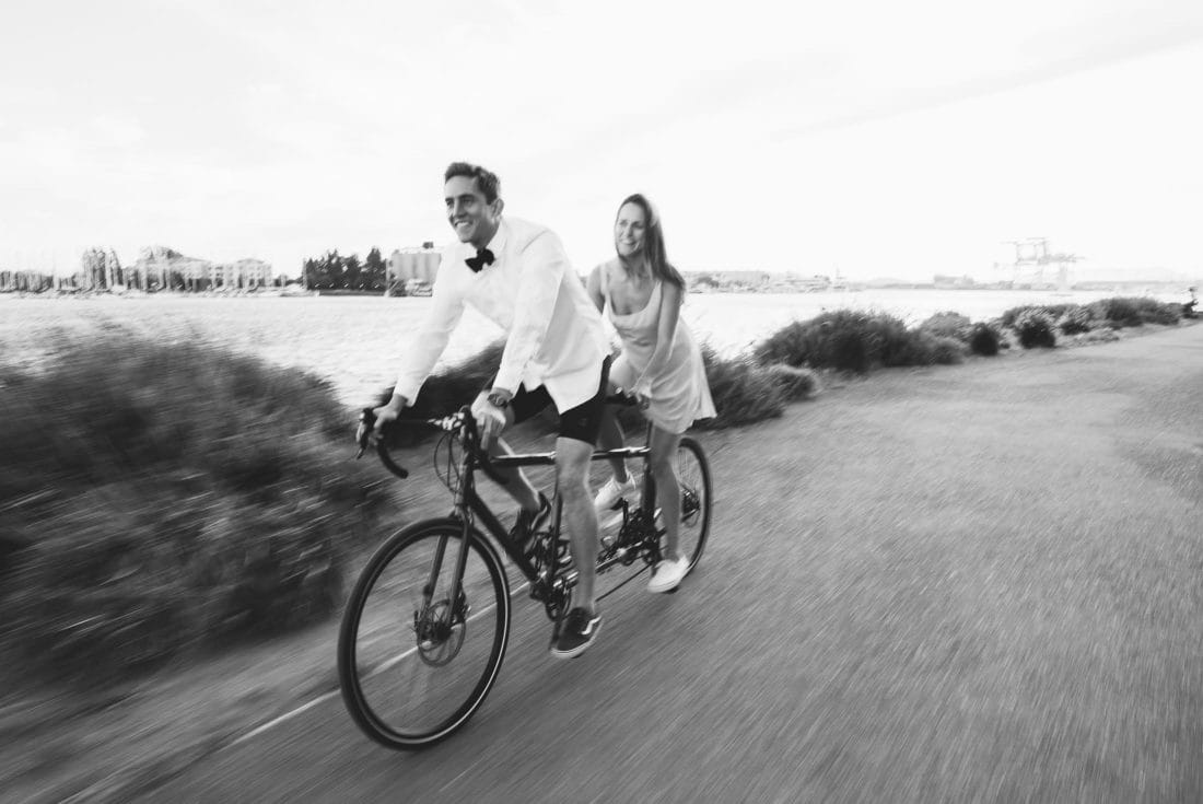 Couple on tandem bike in jack london square engagement session