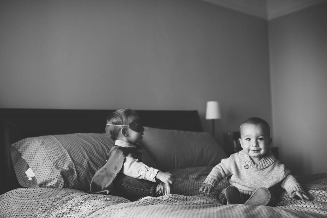 kids on bed with masks at san francisco family shoot