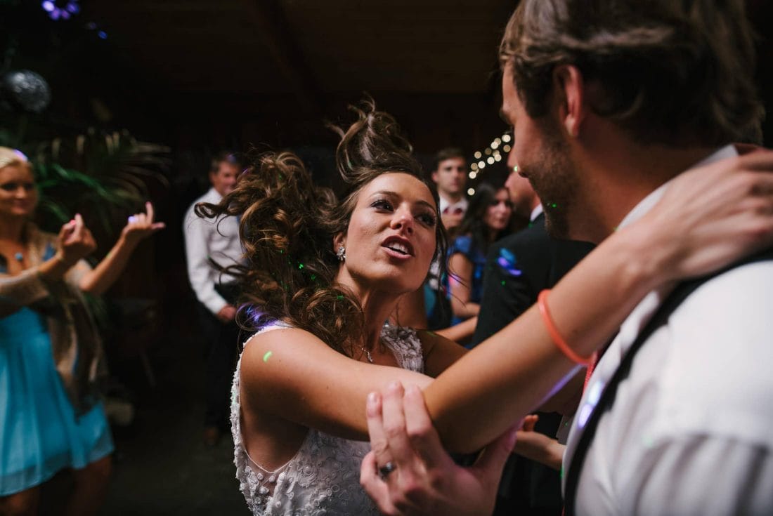 people dancing at the holly farm wedding