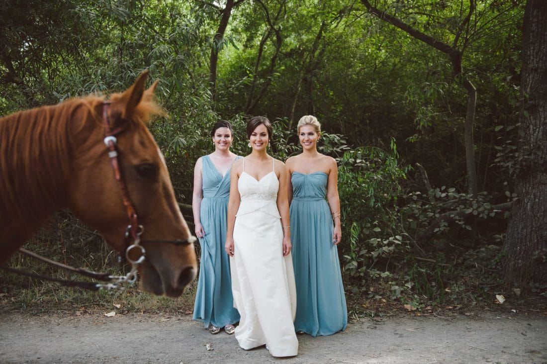 Pelican Inn Bridal Portrait with horse walking in front
